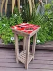 Small, red resin topped, stained pine, plant stand or coffee table