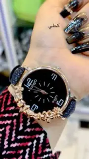 A very elegant women's watch with a black background that can be worn on all occ
