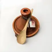 moroccan cooking tagine with wooden spoon and spice mix