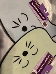 2 Cat Food Bowl Mat. Light Blue and Light Green Whiskers, new with tags