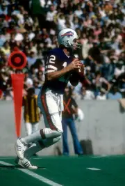 Joe Ferguson Buffalo Bills drops back to pass at an NFL football - 1976 Photo 1