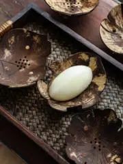 Place soap bars made from coconut shells to decorate your home, hotel, or spa.