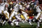 Quarterback Fran Tarkington fakes the hand off to running back Ch- 1974 Photo