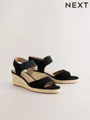 Black Standard Fit Forever Comfort® Round Toe Elastic Strap Detail Wedges (AV7760) | $71