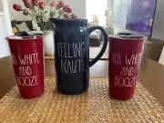 2 RAE DUNN RED WHITE AND BOOZE TRAVEL CERAMIC MUGs & A “FEELING NAUTI”PITCHER.