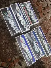 Six “6” Toy Hess Trucks