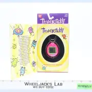 #1800 Pink & Green Tamagotchi 1997 Bandai Virtual Reality Pet NEW SEALED
