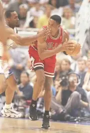 Forward Scottie Pippen Chicago Bulls tries to pass the ball at a p- Old Photo