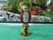 Hand bells, gold bells made in Thailand, call bells and open drink bottle open