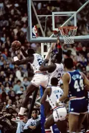 Michael Jordan and Moses Malone Eastern All Stars jump for a rebou- Old Photo