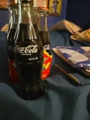 Coca Cola 1990 Around the World 6.5oz Bottle (Green Bottle)