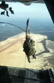 US Air Force USAF (ALO) jumps out of a C-130 Hercules aircraft 12X18 Photograph
