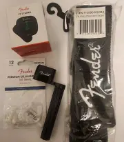 Fender BLOWOUT SALE Guitar Strap medium White MOTO picks string winder and tuner