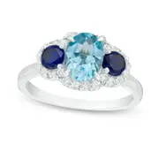 Oval Blue Topaz, Lab-Created Blue and White Sapphire Three Stone Ring in Sterling Silver
