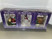 3x- Santa clause/Snowman & Fireplace night lights w/extra bulbs From Costco New