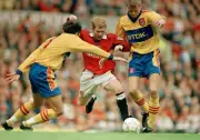Paul Scholes of Manchester United is squeezed out by Marc Edworthy- Old Photo