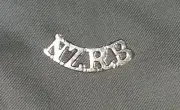 WW1 NZRB SHOULDER TITLE BADGE - GILT REPRODUCTION NEW ZEALAND RIFLE BRIGADE