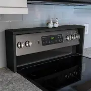 Space-Saving Ebony Spice Shelf for Above Stove Storage in Rustic Designs