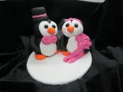 Dusty rose bride and groom penguin / wedding anniversary cake topper