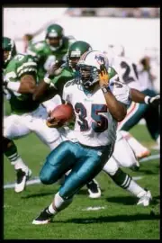 Running back Irving Spikes Miami Dolphins runs with the ball 1997 Old Photo