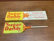 Vintage 1960s giant Sugar Daddy bar with stick in box. Wrapper is in great shape