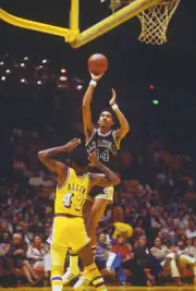 George Gervin San Antonio Spurs shoots over Lucius Allen Los Ange- 1976 Photo