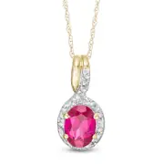 Oval Lab-Created Ruby and 0.05 CT. T.W. Diamond Frame Bypass Pendant in 10K Yellow Gold