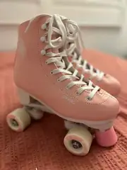 Brand new light pink rollerskates with feather design. Decathalon Oxelo.