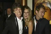 Mick Jagger and actors Sienna Miller and Jude Law arrive at the W- 2004 Photo 2