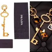 NEW $440 PRADA RUNWAY Gold Tone Metal FLOWER Thorns Logo SKELETON KEY KEYRING