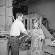 New York Director Arthur Penn helps muddy Patty Duke's pinafor- 1961 Old Photo