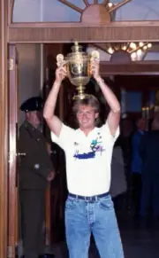 Stefan Edberg of Sweden lifts the trophy after defeating Boris Be - Old Photo 5