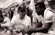 Closeup of Cleveland Browns Jim Brown with coach Blanton Collier i- Old Photo