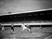 Wolverhampton Wanderers goalkeeper Bert Williams whips ball away f- Old Photo