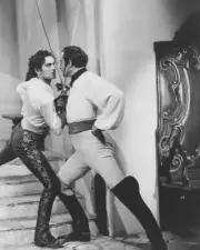 Tyrone Power and Basil Rathbone engage in a sword fighting duel in- Old Photo