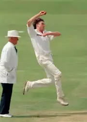 Paul Smith bowling for Warwickshire during the Benson & Hedge- Cricket Photo 1