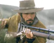 Leonard Nimoy wearing a cowboy hat while aiming a rifle issued for- Old Photo