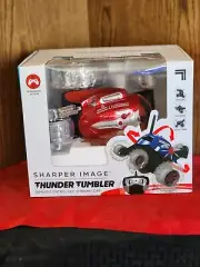 2583. NEW SHARPER IMAGE "THUNDER TUMBLER" REMOTE CONTROL 360° SPINNING CAR RED