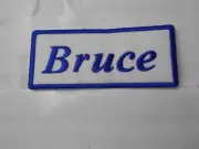 BRUCE NEW EMBROIDERED SEW / IRON ON NAME PATCH BLUE ON WHITE