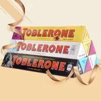 在飛比找淘寶網優惠-瑞士Toblerone三角巧克力5種口味牛奶黑白巧巴旦木蜂蜜