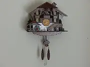 Traditional Black Forest Cuckoo Clock - Handcrafted Dark Walnut, 15.5 with Hourly Cuckoo Call, Moving Wood Chopper, Mill Wheel, Dancing Figurines, Quartz German Design, Volume Control, Auto Night Mode