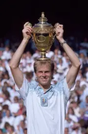 Stefan Edberg of Sweden lifts the trophy after defeating Boris Bec- Old Photo 1