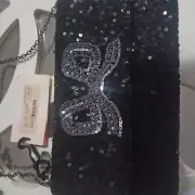 Alannah Hill strike a pose clutch bag