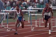 Colin Jackson of Great Britain runs astride Eugene Swift USA at th- Old Photo
