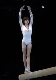 Romanian gymnast Nadia Comaneci pictured in action to win the gol - Old Photo