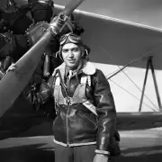 8x10 Print Military WWII Pilot Poses with Plane Aircraft #5501037