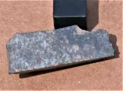 SAU 001 meteorite wedge cut w/crust L5 - 7.1 g (Quality specimen)