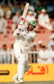 Wasim Akram batting for Pakistan during the Champions Trophy - Old Cricket Photo