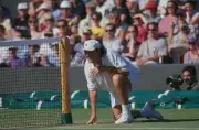 American tennis player Robert Seguso crouching at the net during c- Old Photo