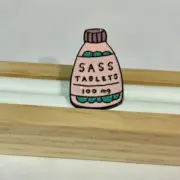 Sass Tablets Enamel Pin - Quirky Accessory for Flair and Fun!